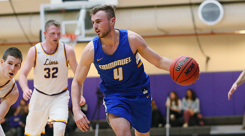 Joe Tamburro handling the ball in a game against Emerson. (Emmanuel athletics photo by Mike Broglio)